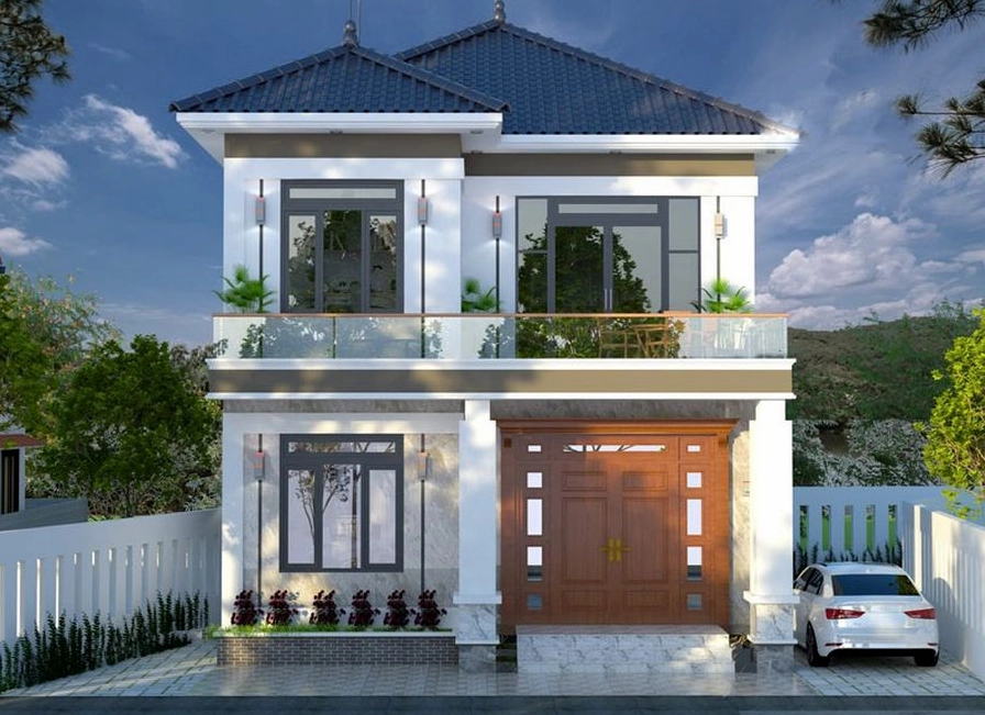 Nhà phố 2 tầng với bố cục đối xứng, hình khối rõ ràng và tỷ lệ kiến trúc cân đối mang lại cảm giác vững chãi, chỉn chu nhưng vẫn giữ được sự ấm cúng cho không gian sống gia đình